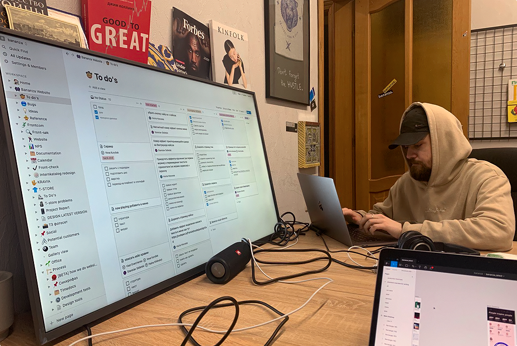A large monitor with Notion application on it